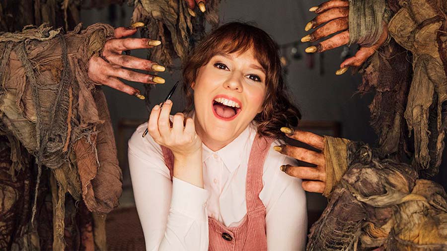 YouTube makeup blogger Sarah surrounded by the dirty hands of the mole people