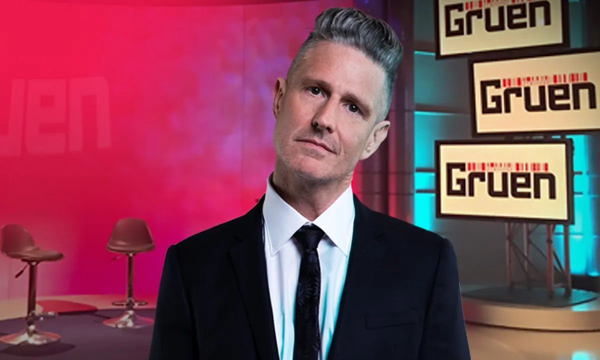 Wil Anderson posing on the set of Gruen
