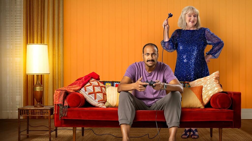 Arthur tries to play a video game while Maggie pulls the plug out