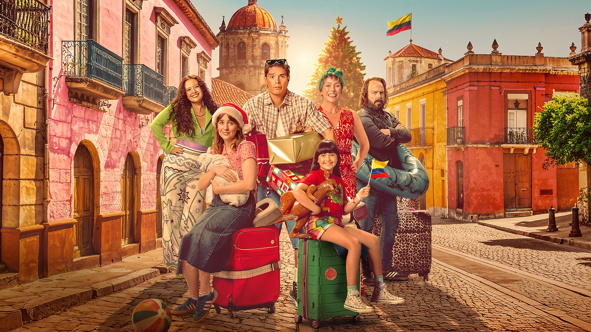 The principal cast of Bump: A Christmas film sitting on luggage in a street in Colombia