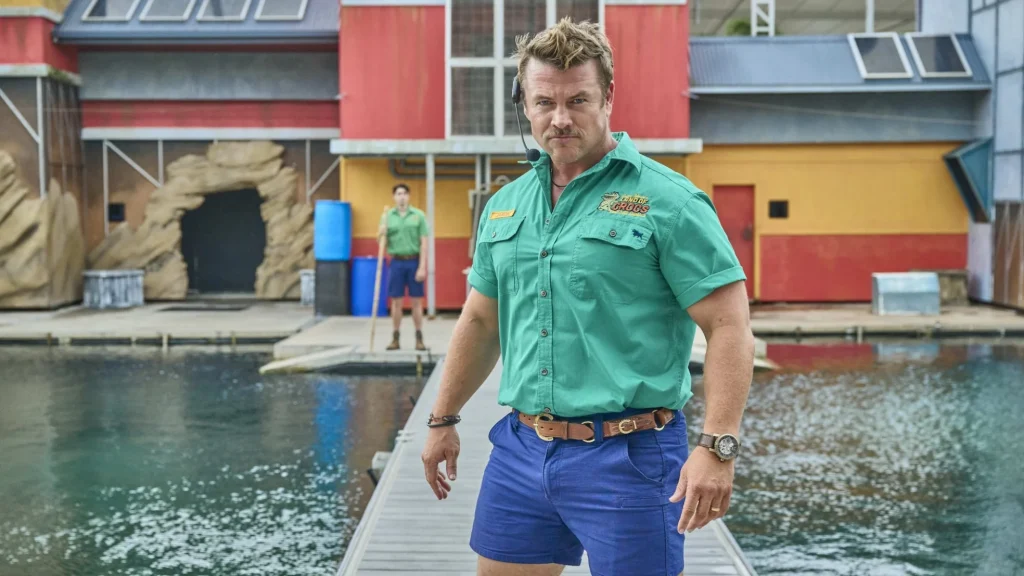 Jason Wade (Luke Hemsworth) looking ready for anything beside his pool of crocodiles
