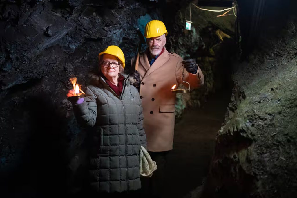Shaun Micallef and Denise Scott in a mine in Germany